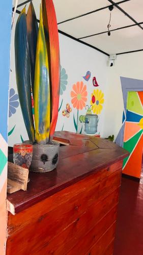 a wooden counter with vases on top of it at Lobster Inn in Trincomalee