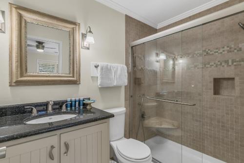 a bathroom with a shower and a toilet and a sink at Beachwalk Villa 5140 in Destin