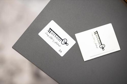 two pieces of paper on top of a table at Maison 31 -Luxury Apartments in Santa Marinella