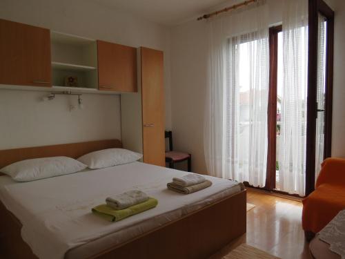 Postel nebo postele na pokoji v ubytování Apartments INES