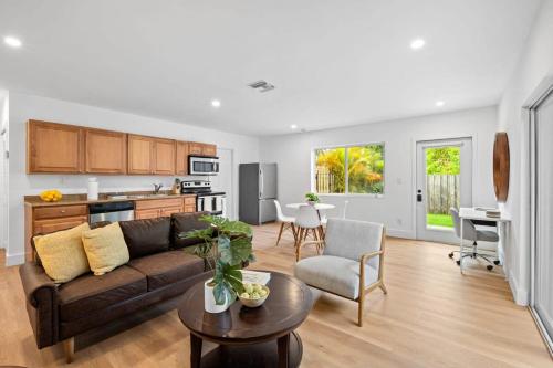a living room with a couch and a table at Awesome 1BR Apartment @Sailboat in Fort Lauderdale