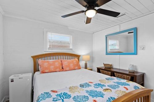a bedroom with a bed and a ceiling fan at Coastal Soul B in Atlantic Beach