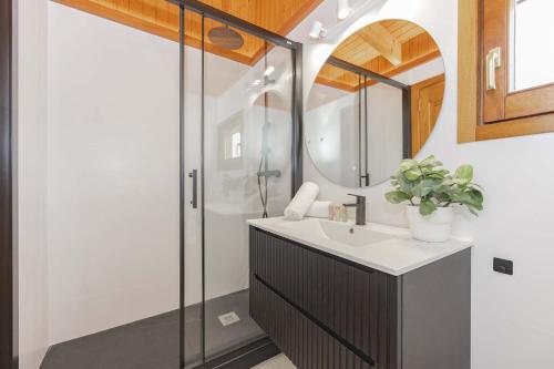 a bathroom with a sink and a shower at Villa Son Rotger in Alcudia