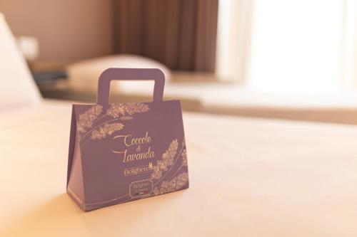 a purple shopping bag sitting on a table at Antico Podere San Francesco in Vada
