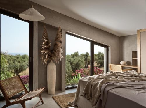 Ένα ή περισσότερα κρεβάτια σε δωμάτιο στο Theros Exotica Loft Villa Contemporary 2BR W pool in Tsilivi Hills
