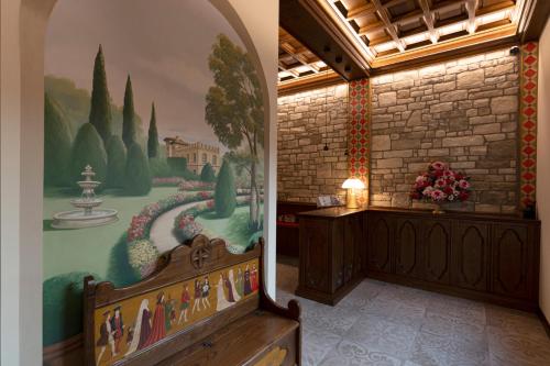 a room with a painting on the side of a wall at Accomodation Hotel Castello Il Codirosso in Cesate