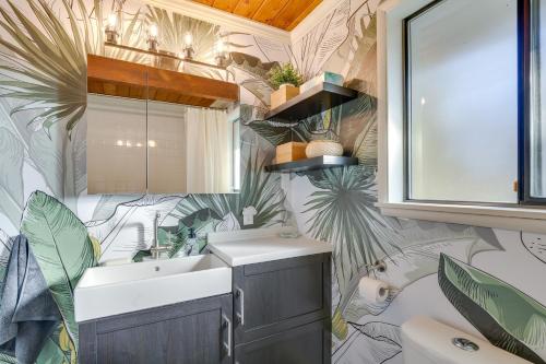 a bathroom with a sink and a mirror at Renton Home with Fire Pit and Nearby Lake Access! in Renton
