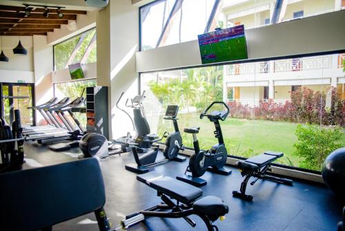 a gym with a bunch of exercise bikes in a room at Vista Sol Punta Cana Beach Resort & Spa - All Inclusive in Punta Cana