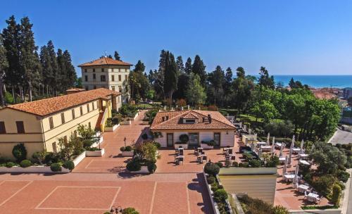 an aerial view of a building with a tennis court at L'Antico Uliveto in Porto Potenza Picena