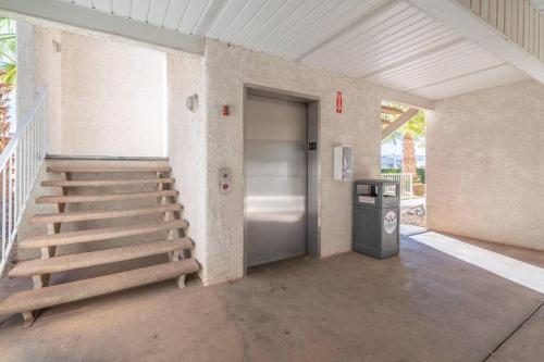 a staircase leading to a door in a building at Perfect Family Escape - 3 Bed Condo with Pools in St. George