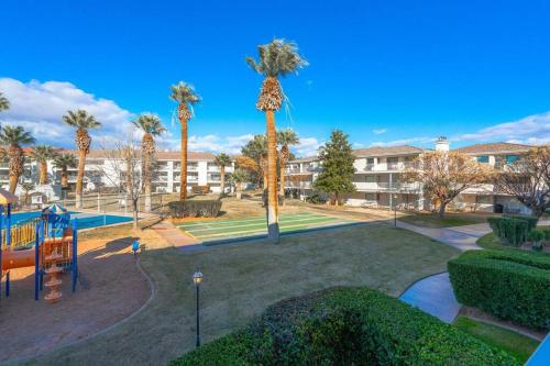 a park with a playground with palm trees at Perfect Family Escape - 3 Bed Condo with Pools in St. George
