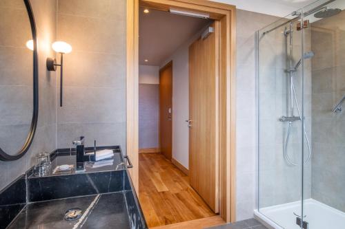 a bathroom with a shower and a sink at Sopot Marriott Resort & Spa in Sopot