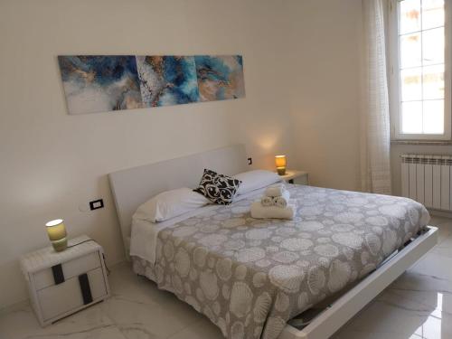 a bedroom with a bed with two candles on it at Casa Patrizia in Monterosso al Mare