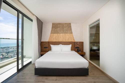Cama ou camas em um quarto em Wins House - Apec Mandala Phú Yên