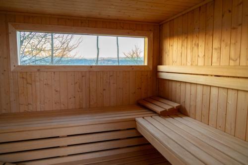 a wooden sauna with a window in it at Torre Veglio in Terruggia