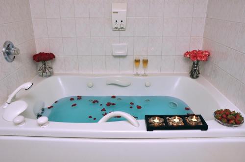 a bath tub with a pool in the middle at Cartier Place Suite Hotel in Ottawa