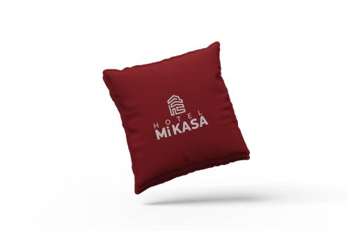 a red pillow with the words not a mimosa on it at Hotel MiKasa in Oliva