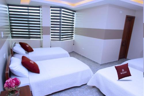 Postel nebo postele na pokoji v ubytování Hotel MiKasa