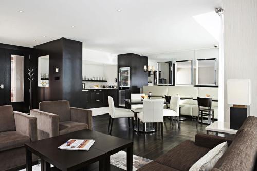 a living room with a couch and a table at The Prince George Hotel in Halifax