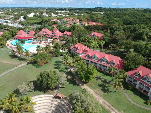 an aerial view of a resort with a swimming pool at Studio Coco Zen in Sainte-Anne