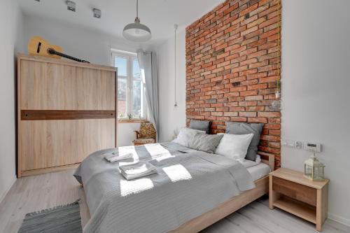 Llit o llits en una habitació de Dom & House - Apartment Sea Of Mint