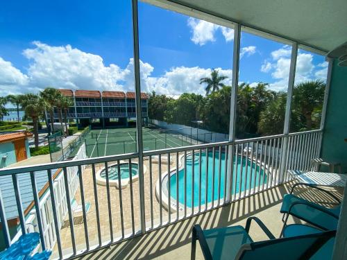 a view of a tennis court from a balcony at The perfect view for your beach getaway in Bradenton Beach