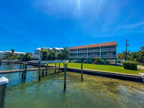 a building next to a body of water at The perfect view for your beach getaway in Bradenton Beach