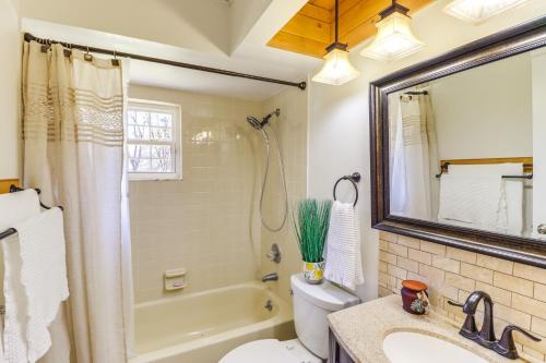 a bathroom with a tub and a toilet and a sink at Gas Grill and Fire Pit Peaceful Dunnellon Home! in Dunnellon