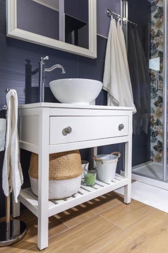 a bathroom with a white sink and a mirror at Dimora Don Antonio in Pontecagnano