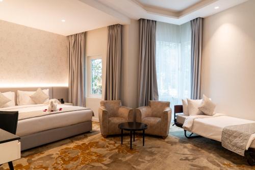 Postel nebo postele na pokoji v ubytování eStay Hotel