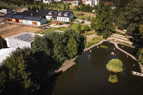 an aerial view of a river with houses and trees at Hospůdka na Haldě in Boršice