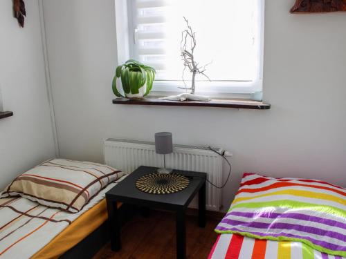 Llit o llits en una habitació de Apartment Parkowa-2 by Interhome