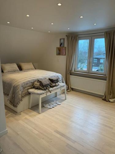 a bedroom with a bed and a large window at The Cheerful Villa In Perstorp in Perstorp