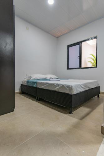 Säng eller sängar i ett rum på Denier House Guabinal Apto 1