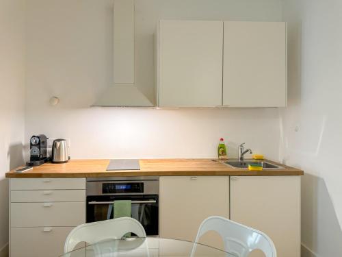 Virtuvė arba virtuvėlė apgyvendinimo įstaigoje Home Mais 36