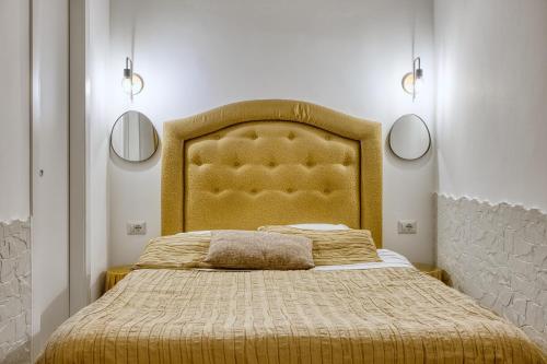 Postel nebo postele na pokoji v ubytování MINI LOFT CAPOCCI - Rione Monti