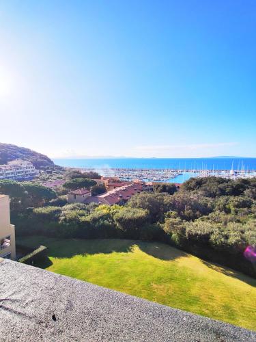 a view of the ocean from the balcony of a house at Holiday Homes Marina apartments in Punta Ala