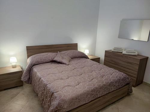 Postel nebo postele na pokoji v ubytování Optima Casa Vacanze II