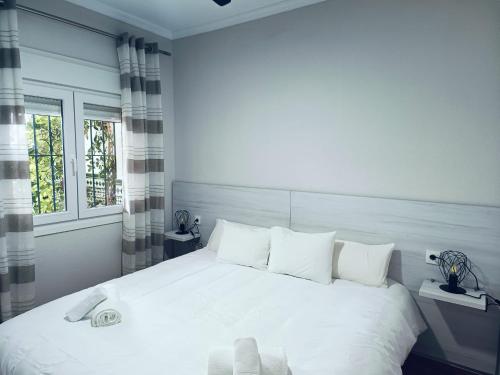 מיטה או מיטות בחדר ב-Apartamento Daysel