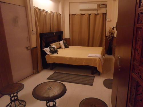 Ένα ή περισσότερα κρεβάτια σε δωμάτιο στο Mcleodganj Bed & Breakfast