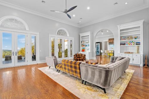 a living room with a couch and a table at Fortaleza l Luxury 8 BR, 7,000+ sqft Palace on 3 Acres with Pickleball & Basketball Court in Helotes