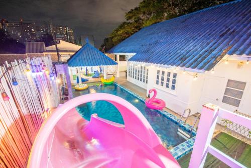 a swimming pool with a slide and a water park at Blue Pool Villa Jomtien / 350m to beach / Big Pool with Slider in Jomtien Beach