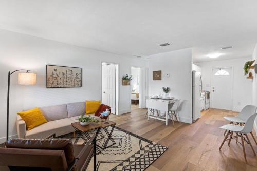 a living room with a couch and a table at The Perfect Escape @Lake Ridge in Fort Lauderdale