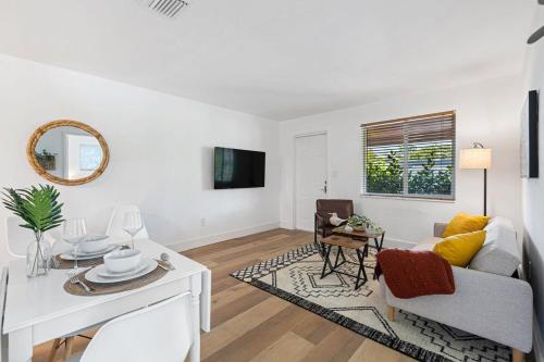 a living room with a couch and a table at The Perfect Escape @Lake Ridge in Fort Lauderdale