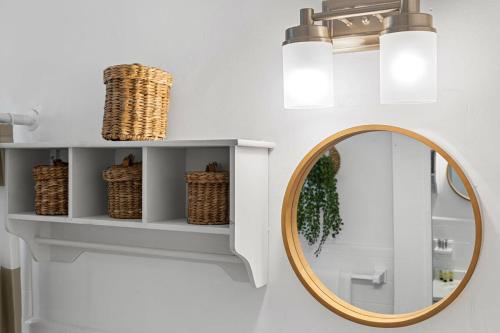 a bathroom with a mirror and a shelf at The Perfect Escape @Lake Ridge in Fort Lauderdale