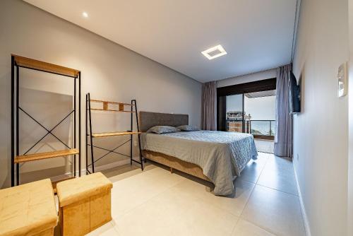 Postel nebo postele na pokoji v ubytování 255 - Cobertura com 03 suítes e Piscina Bombas