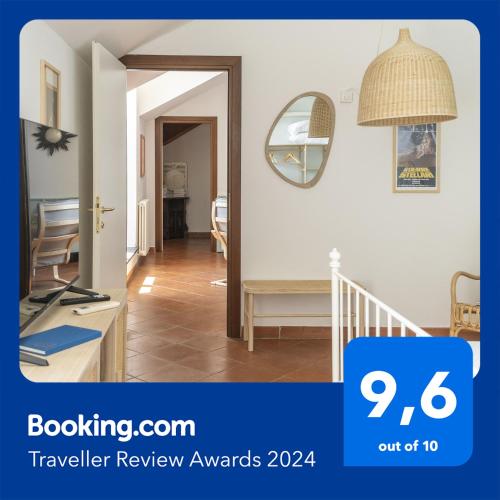 a room with a hallway with a table and a mirror at Palazzo Oddo Rental Rooms in Albenga