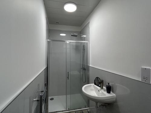a bathroom with a shower and a sink at 3 Bed House Buckie Contractors Business Travellers in Buckie