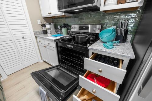 a kitchen with a stove and a counter top at Newly Renovated Condo with Beach access steps away in Myrtle Beach