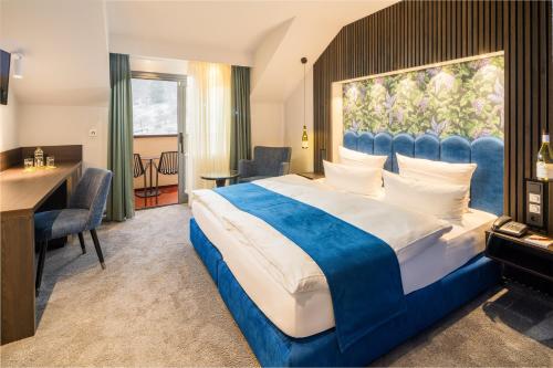 Postel nebo postele na pokoji v ubytování Hotel Heiligenstein